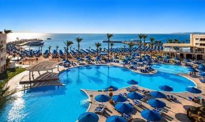 Parasols and loungers across the pools and beach at Alf Laila Wa Laila